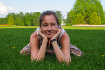 Young woman sitting in yoga pose meditation outdoors