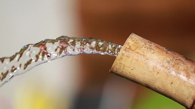 Water Flows From Bamboo Pipe
