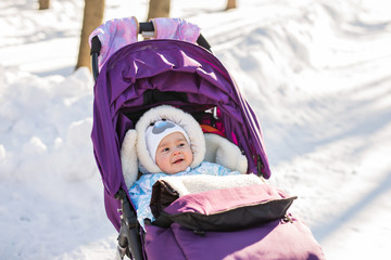 Cute little baby in a stroller outdoor