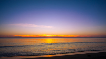 Sunset on the beach with blue sky