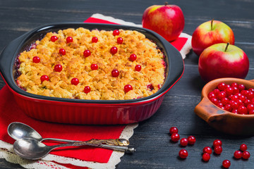 Dessert crumble cake with apples and red berries