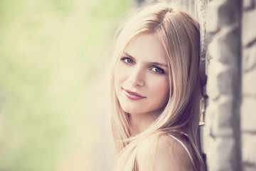 Naklejka premium Vera, blonde face in nature