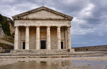 Fototapeta na wymiar Pediment and columns of the church St.George in Corfu .