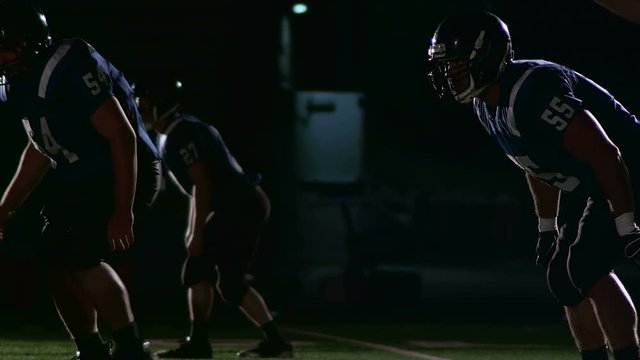 Football players get ready to attack