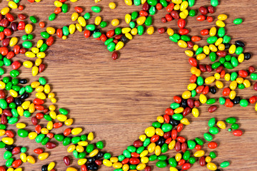 Colored candy lined heart. Declaration of love on the day of St. valetina.