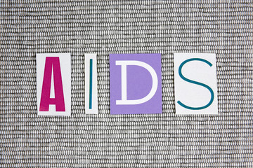 AIDS (Acquired Immune Deficiency Syndrome) acronym on grey background