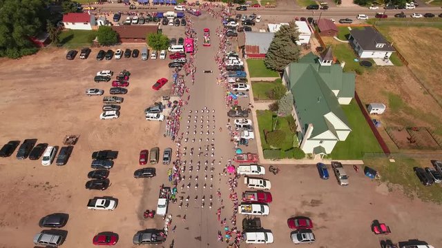 Aerial shot of people watching small town parade