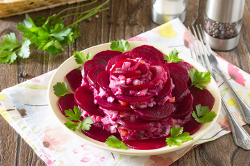 Festive salad an appetizer in the form of rose (from beetroot, e