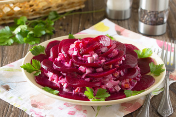Festive decorated salad of beets, an appetizer in the form of ro