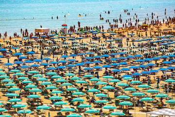 Large group of parasols at the beach of Rimini