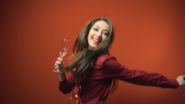 a new year party brunette girl having fun with bocal of champaign