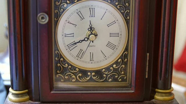 A cool antique clocks hands rotating with time