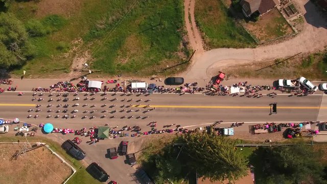 Aerial descending shot of marching band in july 4th parade