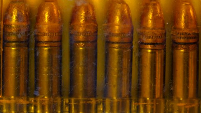 A Dolly shot of bullets in a case