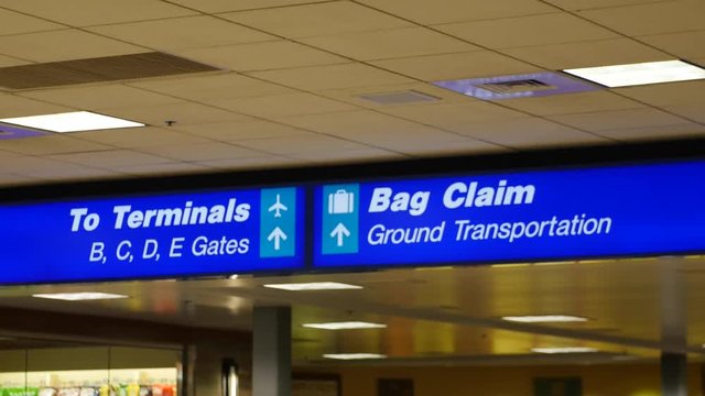 A bag claim sign at the airport