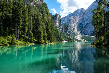 Fototapeta na wymiar View of scenic turquoise Lake Braies in the Dolomites with the mountain in the background, Sudtirol, Italy. 
