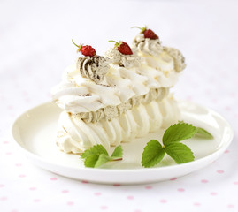 meringue cake with fresh berries on white background