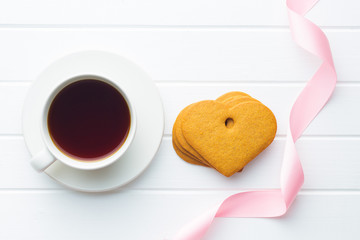 Gingerbread hearts and cup of coffee.
