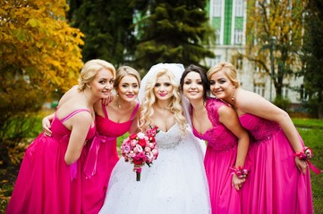 Four bridesmaids having fun with bride