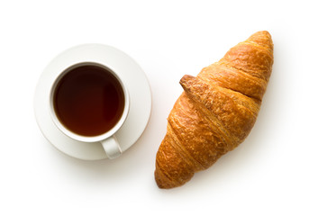 Tasty buttery croissant and cup of coffee.