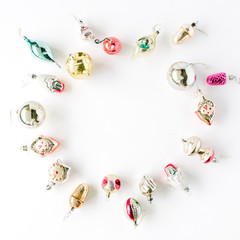 creative arrangement frame of bright christmas balls and toys on white background. flat lay, top view