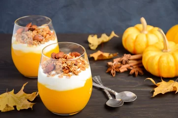 Rolgordijnen Pumpkin dessert with yogurt and homemade granola on dark wooden table, selective focus © julijadmi