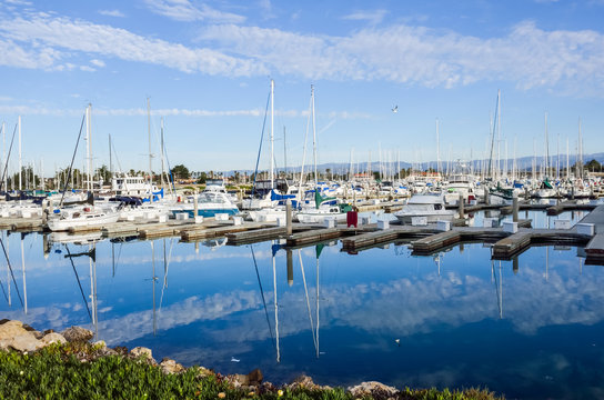 Fototapeta Boats dock and marina with reflection at harbor in Oxnard, California