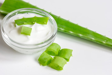 aloe vera - leaves and cream isolated on white background