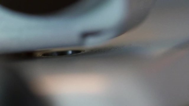A paper getting punched with a three hole punch