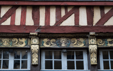 Intricate carving on old timber framed building in Rennes, France