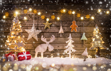 Christmas crafted decoration on wooden background.