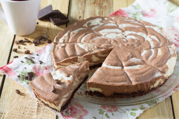 Chocolate cake ice cream zebra on a wooden background.