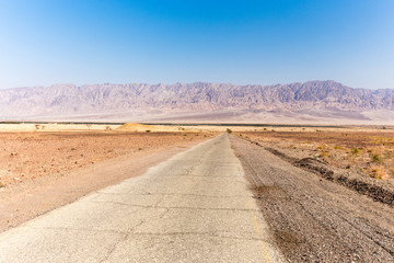 Desert asphalt road mountains range Israel Jordan.