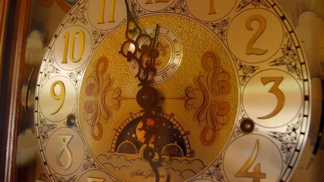 A cool old grandfather clock face in the living room