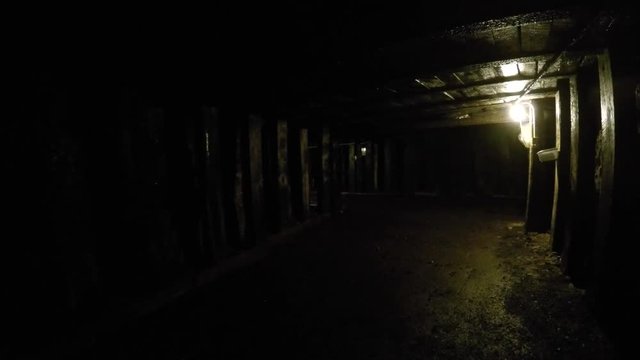 Dark tunnel deep inside coal mine