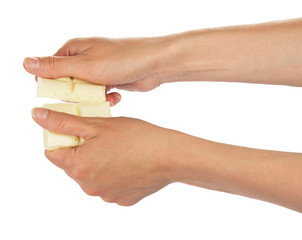 Female hands break bar of white chocolate isolated.