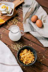 flakes for breakfast and jug of milk top view
