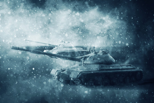 Two battle tanks moving in a snow storm © evilinside