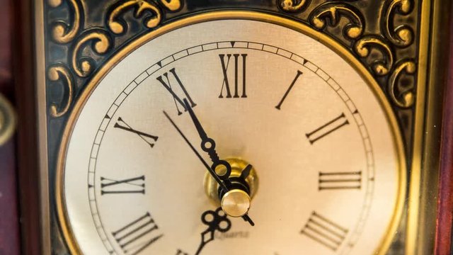A timelapse shot of a cool clock with its hand rotating as time passes