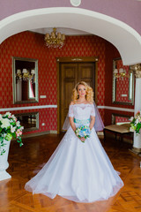 Portrait of a bride in a beautiful classic interior