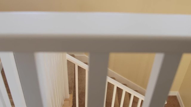 A dolly shot of the staircase in a home
