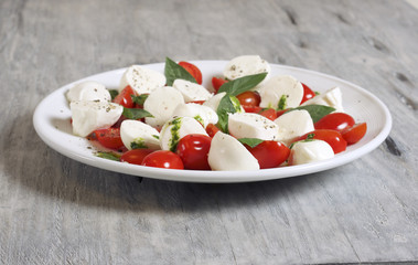 Caprese salad on a white plate