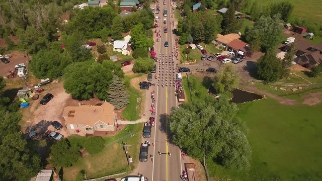 Aerial shot of the crowds watching the small town parade in Utah