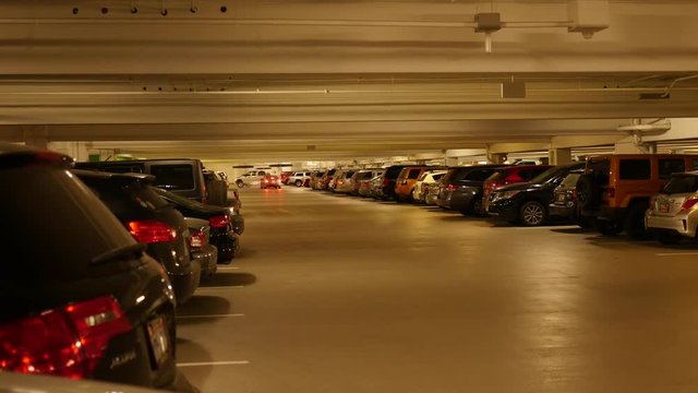A really full underground parking garage with cars