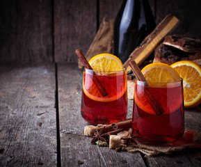 Glasses of mulled wine with orange and cinnamon