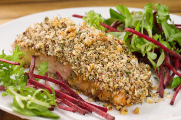 Baked Salmon fish with nuts. Salmon and vegetables.