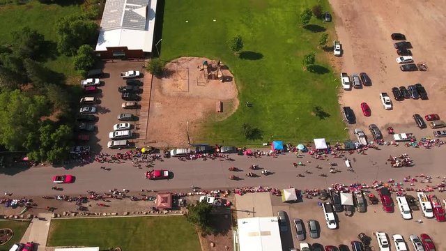 Aerial dolly shot of families watching the july 4th parade