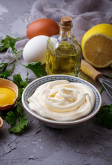 Homemade mayonnaise sauce and olive oil, eggs, mustard, lemon