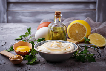 Homemade mayonnaise sauce and olive oil, eggs, mustard, lemon