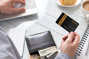Man uses a loyalty card while online shopping